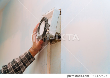 builder at work. cutting wall of electrical work 55377524