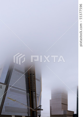 Misty cloudy day residential skyscraper in Midtown Misty cloudy day residential skyscraper in Midtown 55377596