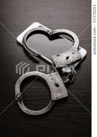 mobile phone and handcuffs 55378201