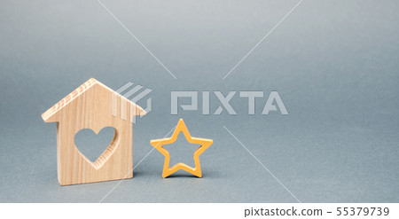 Wooden house and one star. Concept of negative 55379739