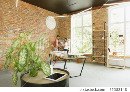 Young couple doing apartment repair together themselves Young couple doing apartment repair together themselves 55382148