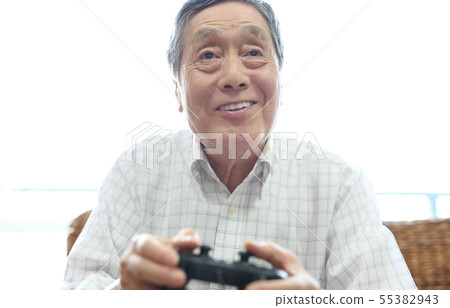 Senior image enjoying video games 55382943