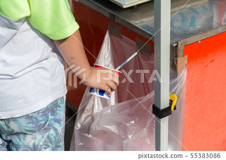 Child throwing away trash Child throwing away trash 55383086
