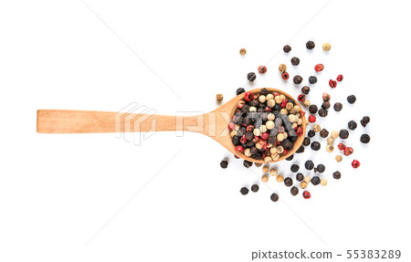 Peppers mixed in wood spoon isolated on white 55383289