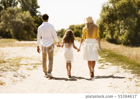 Young family spending time together outside in nature Young family spending time together outside in nature 55384617