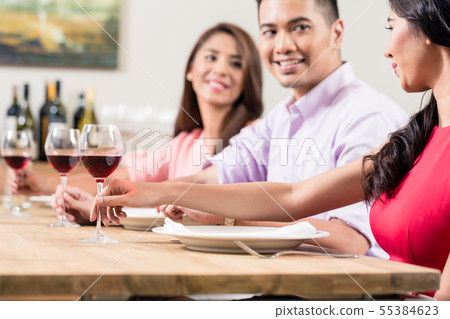 Friends sitting in the restaurant Friends sitting in the restaurant 55384623