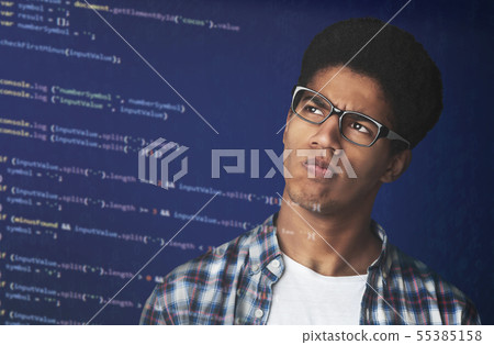 Thoughtful Afro Guy in glasses Looking at strange code Thoughtful Afro Guy in glasses Looking at strange code 55385158