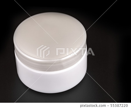 The Beauty Cream Containers on Black Background 55387220