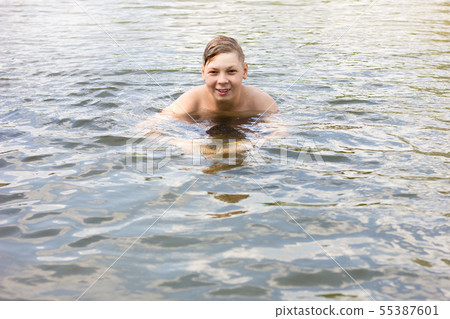 boy bathes in the sea close up, active rest boy bathes in the sea close up, active rest 55387601