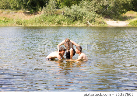 Jumping in the water. Kids have fun and Jumping in the water. Kids have fun and 55387605