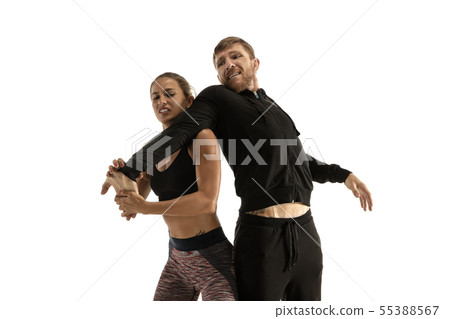 Man and woman fighting in studio, women's self-defense concept Man and woman fighting in studio, women's self-defense concept 55388567