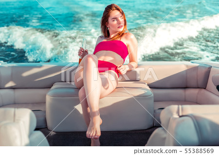 Thoughtful young pretty girl in a swimming suit Thoughtful young pretty girl in a swimming suit 55388569