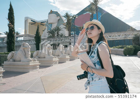 photographer with travelers guide book outdoor 55391174