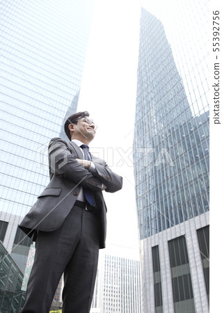 Businessman, building background 55392756