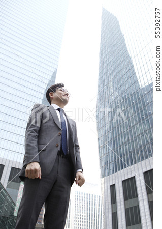 Businessman, building background 55392757