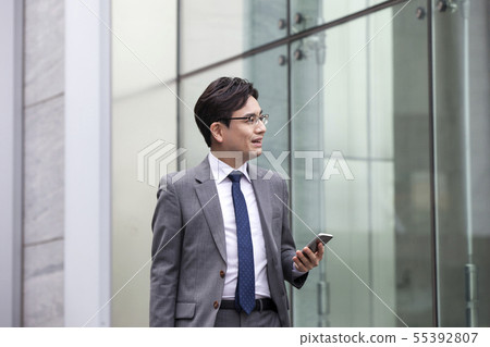 Businessman, building background 55392807