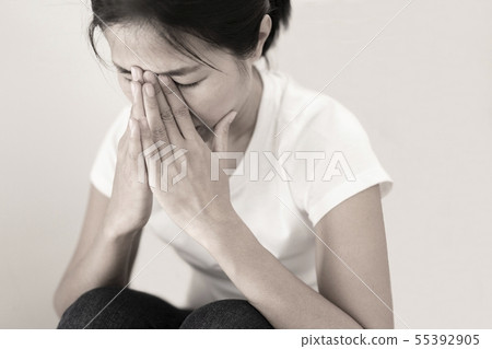 The depression woman alone sitting on staircase. 55392905