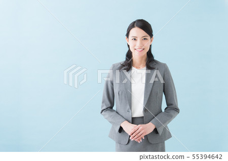 Image of a woman in her 20s wearing a gray suit 55394642