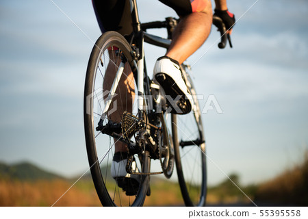 Man cycling road bike in the morning.  55395558
