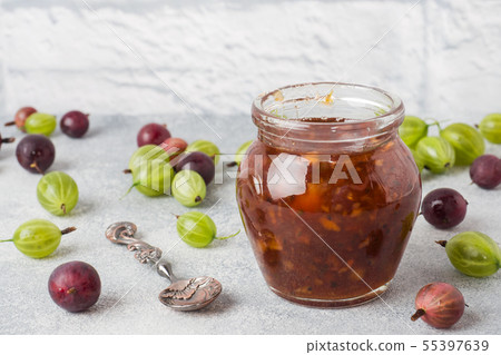 Gooseberry jam in a jar with fresh gooseberry 55397639