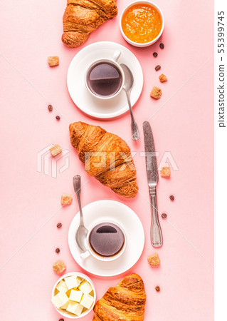 Coffee and croissants on pastel background Coffee and croissants on pastel background 55399745