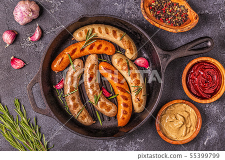 Grilled homemade sausages in a pan. Grilled homemade sausages in a pan. 55399799