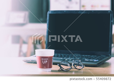 Start work with hot coffee and laptop in morning. 55409872