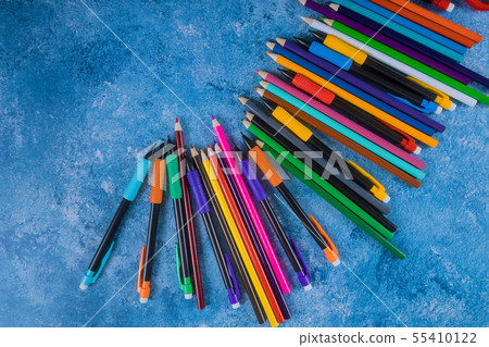 Color pencil on blue background. Back to school 55410122