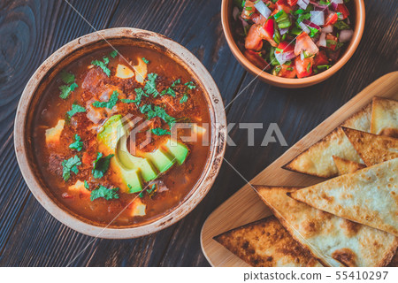 Bowl of spicy Mexican soup 55410297