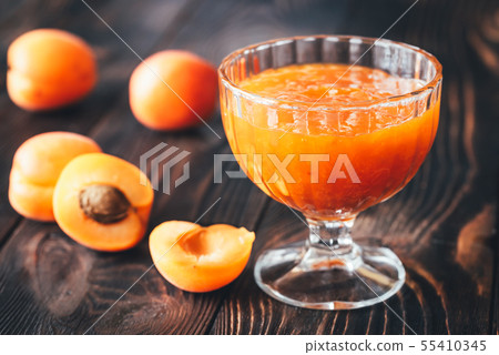 Glass vase of apricot jam Glass vase of apricot jam 55410345