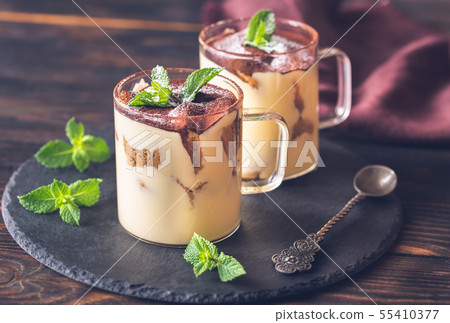 Two glass mugs of tiramisu 55410377