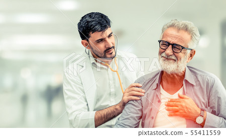 Doctor checking patient health in hospital office. 55411559