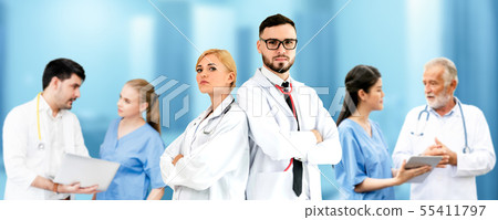 Doctor working in hospital with other doctors. 55411797