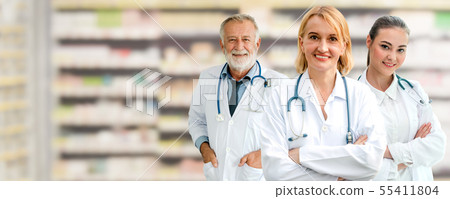 Doctor working in hospital with other doctors. Doctor working in hospital with other doctors. 55411804