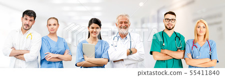 Doctor working in hospital with other doctors. Doctor working in hospital with other doctors. 55411840