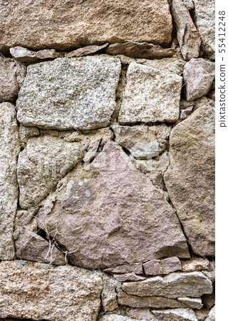 Texture of an irregular stone wall. Background. Texture of an irregular stone wall. Background. 55412248