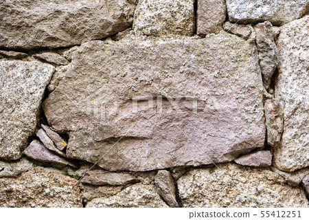 Texture of an irregular stone wall. Background. Texture of an irregular stone wall. Background. 55412251
