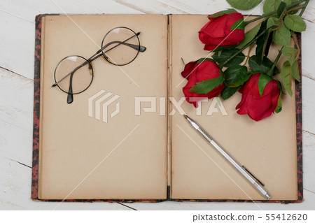 concept romantic, old notebook, roses and glasses concept romantic, old notebook, roses and glasses 55412620