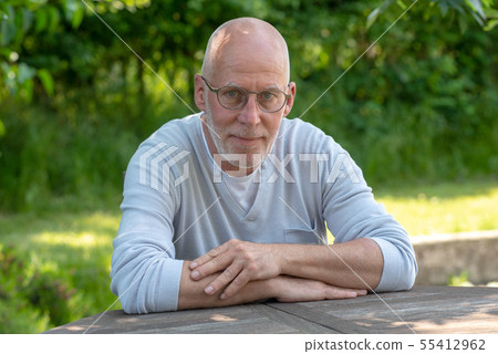 portrait of senior man with glasses, outdoors portrait of senior man with glasses, outdoors 55412962
