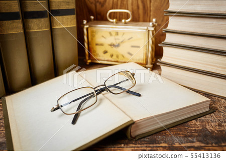 Group of school supplies and books on wooden table Group of school supplies and books on wooden table 55413136