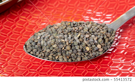 green lentils in a spoon 55413572