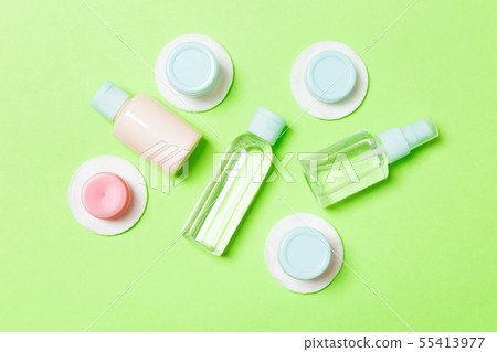 Group of small bottles for travelling on green Group of small bottles for travelling on green 55413977