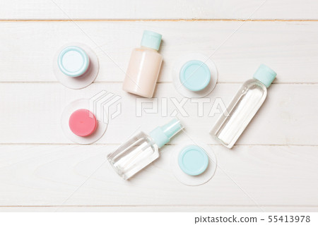 Set of travel size cosmetic bottles on white Set of travel size cosmetic bottles on white 55413978