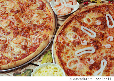 Pizza with shrimp, salmon and squid Pizza with shrimp, salmon and squid 55415311