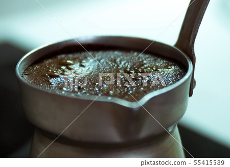 Boiling black coffee macro closeup Boiling black coffee macro closeup 55415589