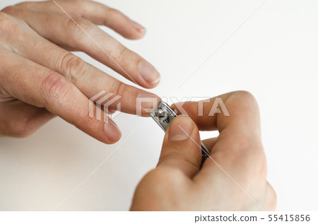 A young man does a manicure. Photo. A young man does a manicure. Photo. 55415856