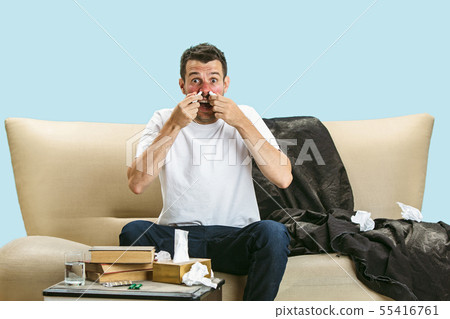Young man suffering from hausehold dust or seasonal allergy 55416761