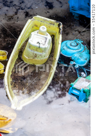 Flooded sandpit with toys after the rain Flooded sandpit with toys after the rain 55417110