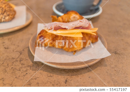 French breakfast. Coffee and croissant sandwich on 55417197