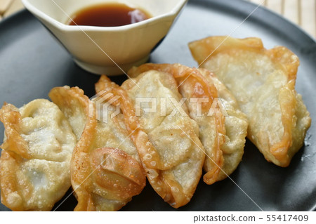 deep fried Gyoza or Japanese dumpling stuffed pork deep fried Gyoza or Japanese dumpling stuffed pork 55417409